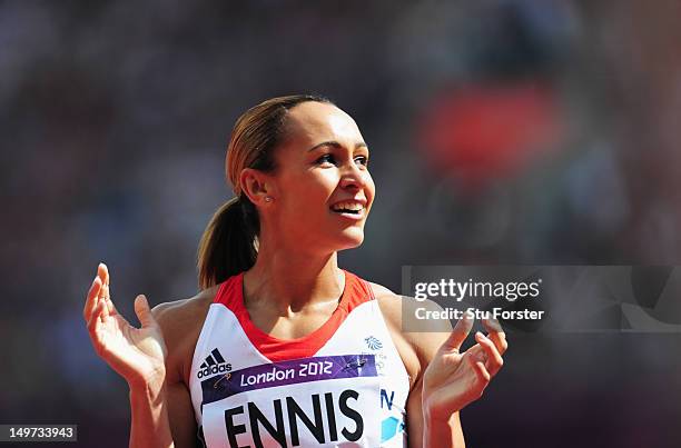 Jessica Ennis of Great Britain looks to the scoreboard after competing in the Women's Heptathlon 100m Hurdles Heat 1 on Day 7 of the London 2012...