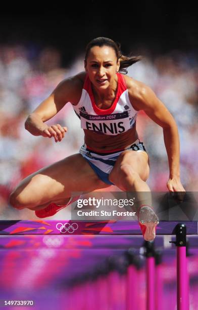 Jessica Ennis of Great Britain competes in the Women's Heptathlon 100m Hurdles Heat 1 on Day 7 of the London 2012 Olympic Games at Olympic Stadium on...