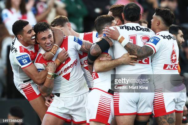Jaydn Su'a of the Dragons celebrates with team mates after scoring a try during the round 15 NRL match between St George Illawarra Dragons and South...