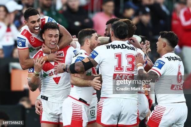 Jaydn Su'a of the Dragons celebrates with team mates after scoring a try during the round 15 NRL match between St George Illawarra Dragons and South...