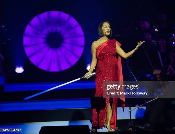 Host Janette Manrara holding a Lightsaber at The Disney 100 Arena Tour at Bournemouth B.I.C on June 08, 2023 in Bournemouth, England.