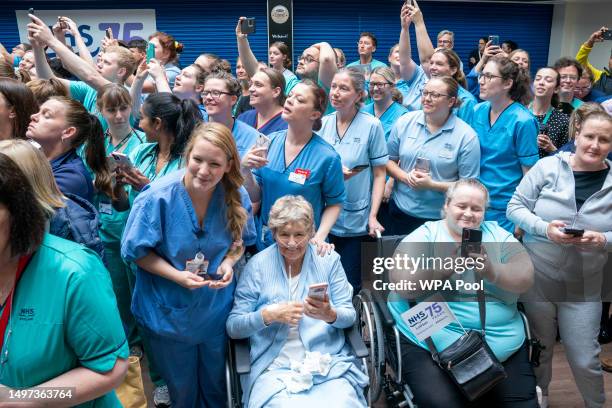 Staff and patients wait to meet King Charles III and Queen Camilla as they visit NHS Lothian's Medicine of the Elderly Meaningful Activity Centre at...