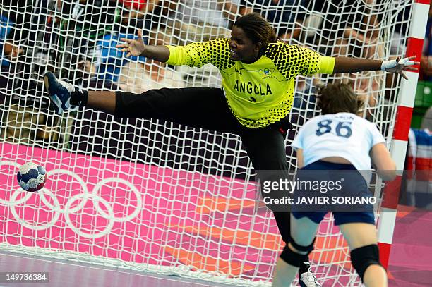 Angola's goalkeeper Cristina Direito tries to make a save during the women's preliminary Group A handball match Angola vs Great Britain for the...