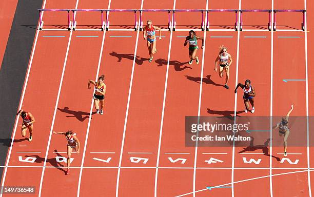 Jessica Ennis of Great Britain crosses the finish line in lane 8 as she competes in the Women's Heptathlon 100m Hurdles Heat 1 on Day 7 of the London...
