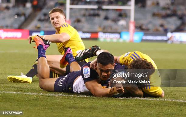 Len Ikitau of the Brumbies celebrates scores a try during the Super Rugby Pacific Quarter Final match between Brumbies and Hurricanes at GIO Stadium,...