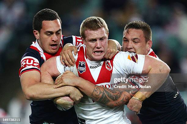 Ben Creagh of the Dragons is tackled during the round 22 NRL match between the Sydney Roosters and the St George Illawarra Dragons at Allianz Stadium...