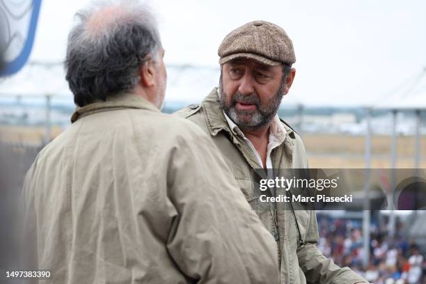 Kad Merad and Raphaël Mezrahi are seen filming the movie 'Finalement' during the 100th anniversary of the 24 Hours of Le Mans at the Circuit de la...