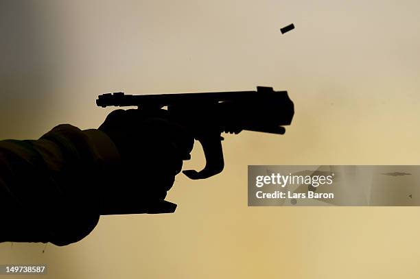 David J Chapman of Australia competes in the Men's 25m Rapid Fire Pistol Shooting on Day 7 of the London 2012 Olympic Games at The Royal Artillery...