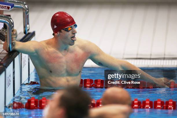 Adam Brown of Great Britain reacts after Great Britain won the Men's 4x100 Medley Relay heat 1 on Day 7 of the London 2012 Olympic Games at the...