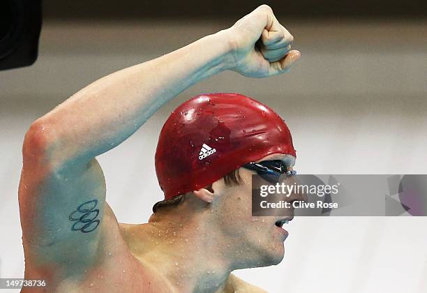 Adam Brown of Great Britain reacts after Great Britain won the Men's 4x100 Medley Relay heat 1 on Day 7 of the London 2012 Olympic Games at the...