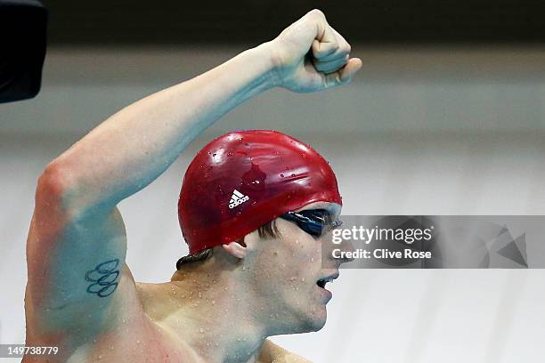 Adam Brown of Great Britain reacts after Great Britain won the Men's 4x100 Medley Relay heat 1 on Day 7 of the London 2012 Olympic Games at the...