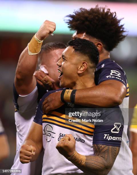 Brumbies players celebrate winning the Super Rugby Pacific Quarter Final match between Brumbies and Hurricanes at GIO Stadium, on June 10 in...