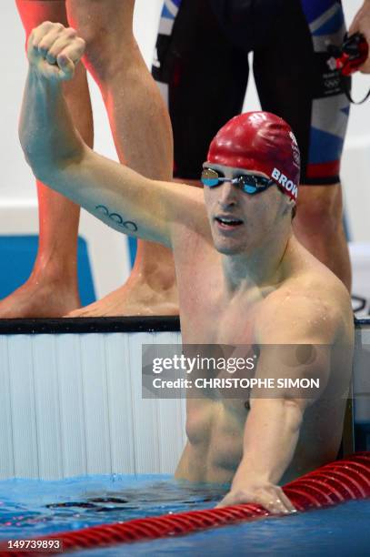 Britain's Adam Brown reacts after he competed in the men's 4x100m medley relay heats during the swimming event at the London 2012 Olympic Games on...