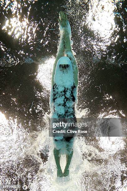 Yi Tang of China dives into the pool for the change over in the Women's 4x100m Medley Relay heat 1 on Day 7 of the London 2012 Olympic Games at the...