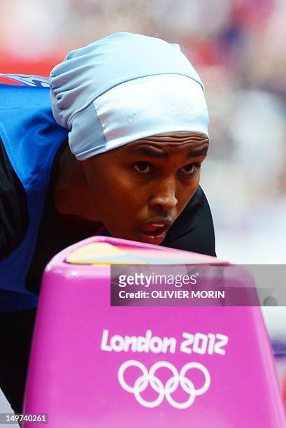 Somalia's Zamzam Mohamed Farah takes the start of the women's 400m heats at the athletics event during the London 2012 Olympic Games on August 3,...