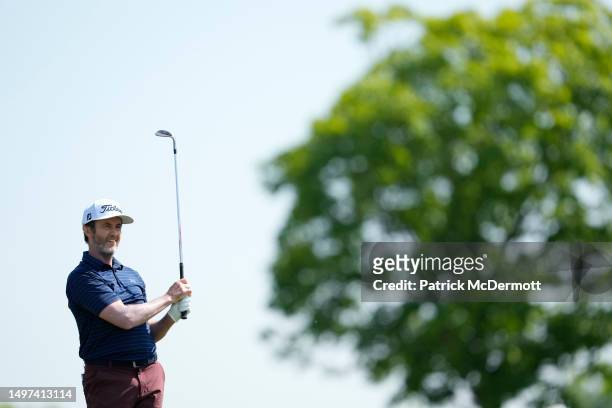Mark Hensby of the United States hits from the fairway on the first hole during the first round of the American Family Insurance Championship at...