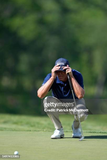 Steve Stricker of United States lines up a putt on the 18th green during the first round of the American Family Insurance Championship at University...