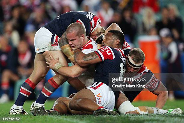 Dan Hunt of the Dragons is tackled during the round 22 NRL match between the Sydney Roosters and the St George Illawarra Dragons at Allianz Stadium...