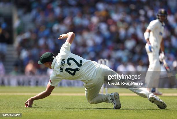 Cameron Green of Australia takes a catch to dismiss off Shubman Gill of India the bowling of Scott Bolland of Australia during day four of the ICC...