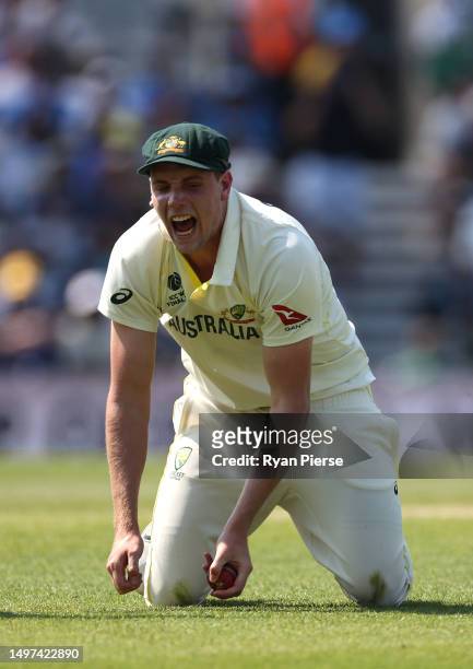 Cameron Green of Australia celebrates after taking a catch to dismiss off Shubman Gill of India the bowling of Scott Bolland of Australia during day...