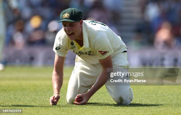 Cameron Green of Australia celebrates after taking a catch to dismiss off Shubman Gill of India the bowling of Scott Bolland of Australia during day...