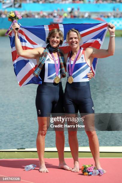 Katherine Grainger and Anna Watkins of Great Britain celebrate with their gold medals draped in a Union Jack during the medal ceremony for the...