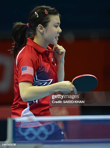 Ariel Hsing of the US celebrates a point against Japan's Ai Fukuhara during their womens's team table tennis match at The Excel Centre in London on...