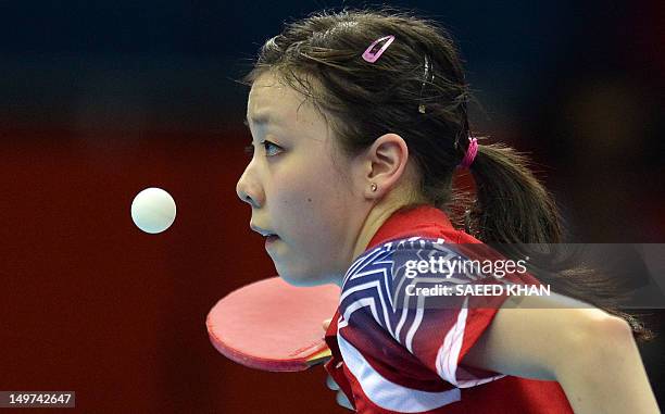 Ariel Hsing of the US serves to Japan's Ai Fukuhara during their womens's team table tennis match at The Excel Centre in London on August 3 during...