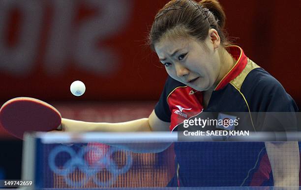 Japan's Ai Fukuhara returns a shot to Ariel Hsing of the US during their women's team table tennis match at The Excel Centre in London on August 3...