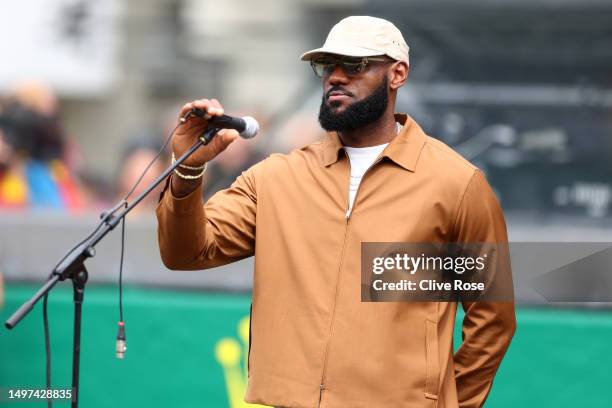 Honorary race starter, LeBron James of the United States looks on prior to waving the flag to start the 100th anniversary of the 24 Hours of Le Mans...