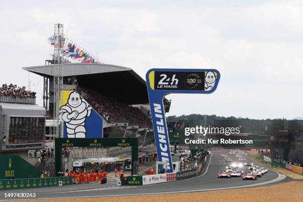 The Ferrari AF Corse Ferrari 499P of Nicklas Nielsen and the Ferrari AF Corse Ferrari 499P of James Calado lead the field at the start of the 100th...