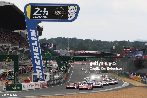 The Ferrari AF Corse Ferrari 499P of Nicklas Nielsen and the Ferrari AF Corse Ferrari 499P of James Calado lead the field at the start of the 100th...
