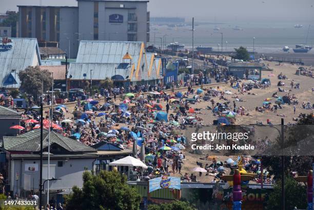 Crowds of people gather to enjoy the warm sunny weather on Jubilee beach on June 10, 2023 in Southend, England. Heat health warnings have been issued...