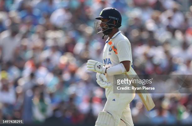 Cheteshwar Pujara of India looks dejected after being dismissed by Pat Cummins of Australia during day four of the ICC World Test Championship Final...