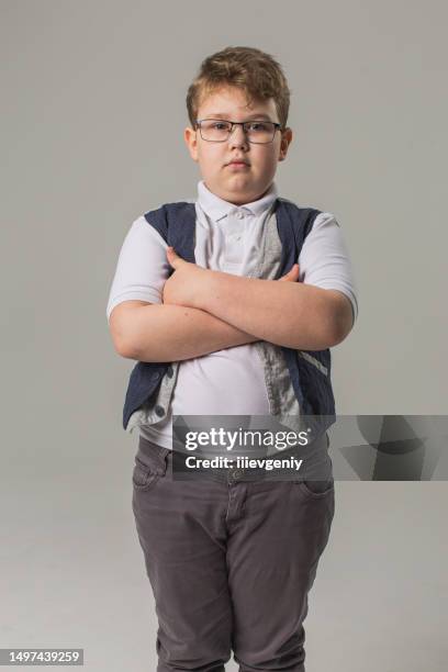 blonde boy in glasses and jeans with vest in studio on gray background. child. childhood. schoolboy - personalized medicine stock pictures, royalty-free photos & images