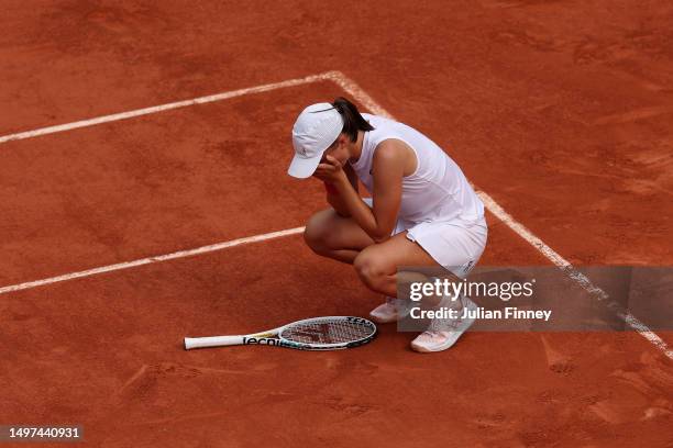 Iga Swiatek of Poland celebrates winning match point against Karolina Muchova of Czech Republic during the Women's Singles Final match on Day...