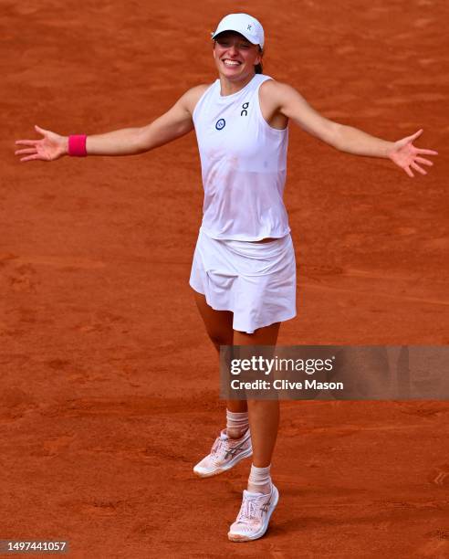 Iga Swiatek of Poland celebrates winning match point against Karolina Muchova of Czech Republic during the Women's Singles Final match on Day...