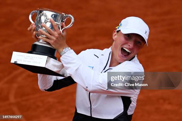 Iga Swiatek of Poland celebrates with her winners trophy after victory against Karolina Muchova of Czech Republic in the Women's Singles Final match...