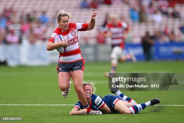 Natasha Hunt of Gloucester-Hartpury is tackled by Lucy Burgess of Bristol Bears during the Allianz Premier 15s Semi Final match between...