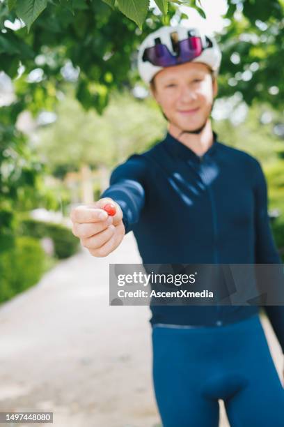 road cyclist finds wild cherries - loire valley spring stock pictures, royalty-free photos & images