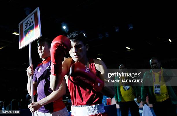 Juliao Henriques Neto of Brazil arrives to face Jeyvier Cintron Ocasio of Puerto Rico in their round of 16 Flyweight match of the London 2012 Olympic...