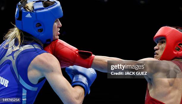 Juliao Henriques Neto of Brazil defends against Jeyvier Cintron Ocasio of Puerto Rico in their round of 16 Flyweight match of the London 2012 Olympic...