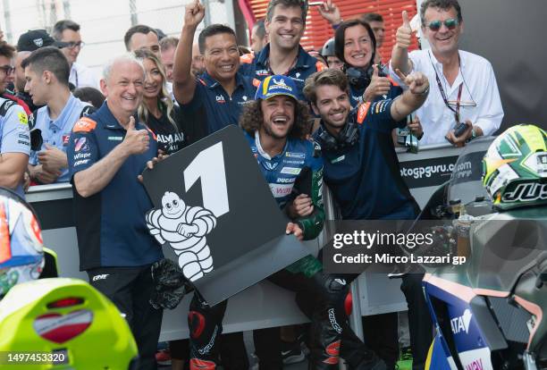 Andrea Mantovani of Italy and RNF MotoE Team celebrates with team on the podium during the MotoE race 1 during the MotoGP of Italy - Qualifying at...