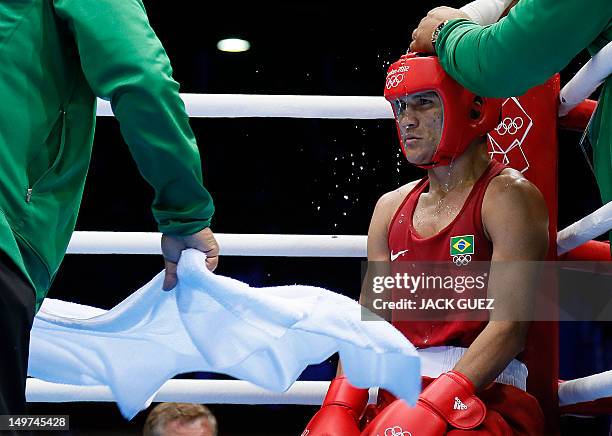 Juliao Henriques Neto of Brazil takes a breather between rounds against Jeyvier Cintron Ocasio of Puerto Rico in their round of 16 Flyweight match of...