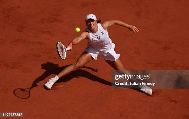 Iga Swiatek of Poland in action against Karolina Muchova of Czech Republic during the Women's Singles Final match on Day Fourteen of the 2023 French...