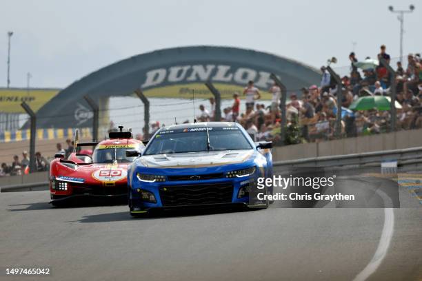 The NASCAR Next Gen Chevrolet ZL1 driven by Jimmie Johnson, Jenson Button and Mike Rockenfeller drives during the 100th anniversary of the 24 Hours...