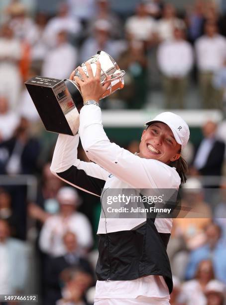 Iga Swiatek of Poland celebrates with her winners trophy after victory against Karolina Muchova of Czech Republic in the Women's Singles Final match...