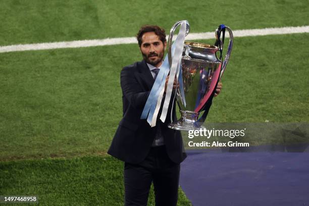 Hamit Altintop, former player presents the UEFA Champions League trophy prior to the UEFA Champions League 2022/23 final match between FC...