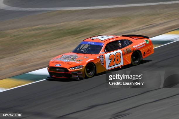 Aric Almirola, driver of the Michael Roberts Construction Ford, drives during qualifying for the NASCAR Xfinity Series DoorDash 250 at Sonoma Raceway...