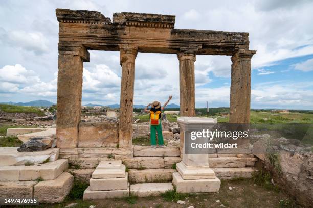 female traveller girl is on blaundus ancient city ruins in ulubey usak turkey - lydia stock pictures, royalty-free photos & images